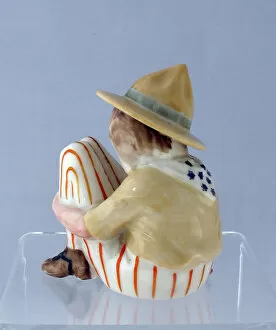 Squatting Collection: Grafton china figure of a squatting American Doughboy