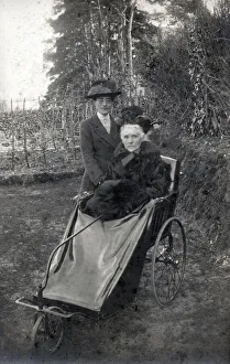 Wrapped Collection: A rather grand-looking elderly lady going out for a spin in her bath chair along with her