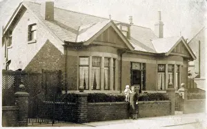 Grandmother and Grandchild posing (proudly) outside their lovely double-fronted period property