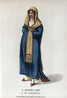 Balkan Prints: Greek lady wearing a blue dress and yellow shawl