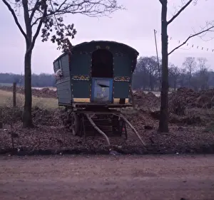 Green gipsy caravan at the side of the road