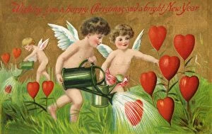 Greetings card with cherubs watering heart flowers