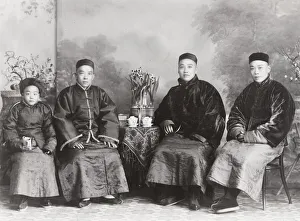 Group of affluent Chinese men with a boy