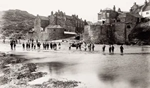 Group on the beach at Robin Hoods Bay, Yorkshire, England