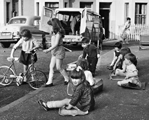 Doors Gallery: Group of children playing on a Balham street, SW London