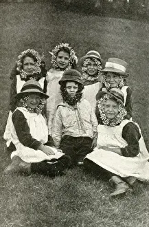 Group of children wearing wild flowers, Somerset, England