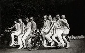 Group of fun-loving fashionable people on two vintage motorc