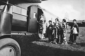Kimonos Prints: A group of Japanese women board an aircraft