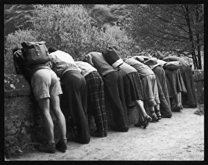 Peering Prints: Group Looking over Wall