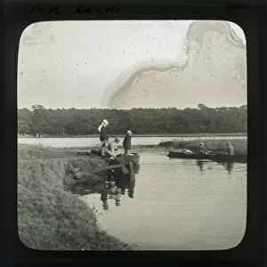 Images Dated 20th May 2019: Group of men boating on a lake