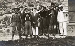 Group of men in fancy dress and makeup, USA