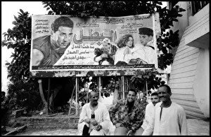 Group of men and film poster Alexandria, Egypt