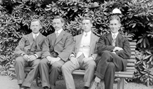 Group of four men with hats Group of four men with hats