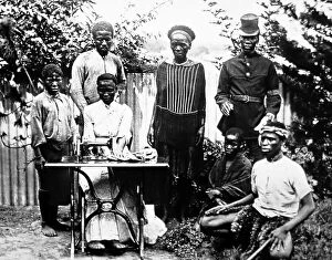 Missionary Collection: Group of people in Natal, Africa with a sewing machine