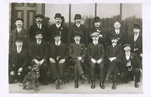 Group photo of men with a dog