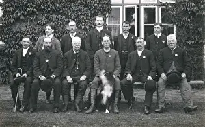 Eleven Prints: Group photo of men with a dog