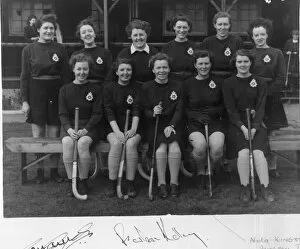 Group photo, women police officers in hockey team