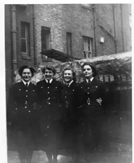 Group photo, four women police officers, London