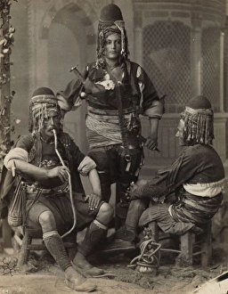 Group portrait of three men, one smoking a nargile; possibly Group portrait of three men, one smoking a nargile; possibly