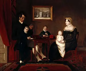 Group portrait of an unidentified family in a domestic inter