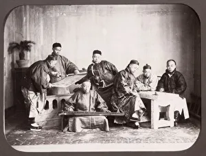 Group of seated Chinese men, musician, China
