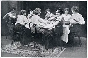 Indoors Prints: A group of society ladies enjoying a cup of tea and biscuits together. Date: 1910