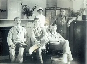 A group of Tommies and two nurses relaxing in the garden
