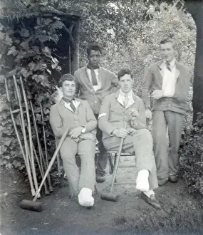 A group of Tommies and two nurses relaxing in the garden