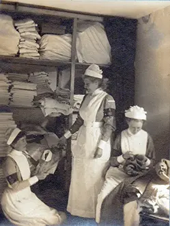 A group of Tommies and two nurses relaxing in the garden