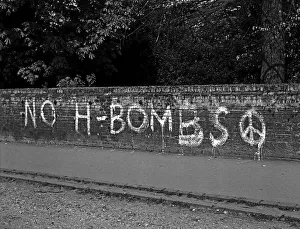 Nuclear Prints: NO H -BOMBS slogan on brick wall
