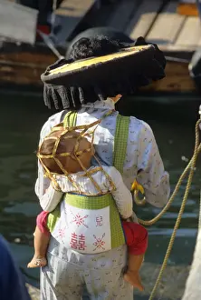 Infant Prints: A Hakka woman carrying her infant child in a papoose