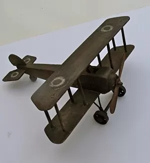 Undercarriage Collection: A hand-made wooden model of a WWI biplane