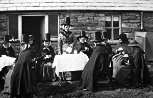 Hand tinted photo of ladies in traditional Welsh dress
