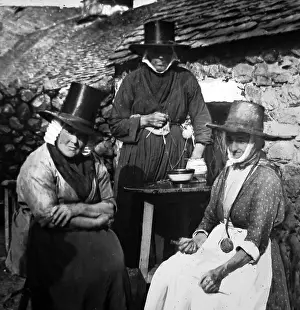 Hand tinted photo of Welsh ladies in traditional costume