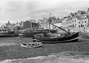 Harbour scene with fishing boats and houses, Scotland