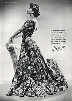 Harrods Prints: Harrods advertisement for a Maggy Rouff flower-garden printed chintz evening gown with an off-the-shoulder neckline