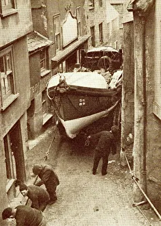 Hauling Prints: Hauling the lifeboat through a narrow street
