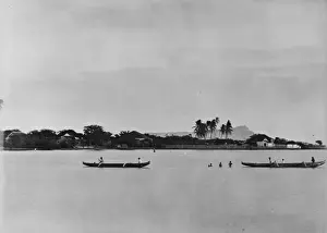 Hawaiian canoes, Diamond Head in background. Oahu, Hawaii