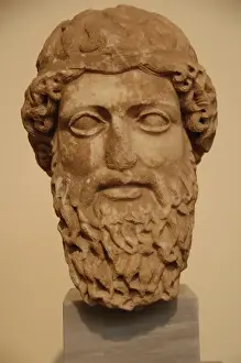 Pentelic Prints: Head of a bearded god in Pentelic marble probably depicting