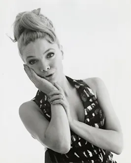 Dizzy Gallery: Head and shoulders portrait of a blonde model. Date: late 1960s