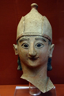 Apollon Collection: Head from a statue of a warrior with conical helmet. 625-600
