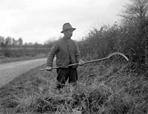 Images Dated 3rd April 2012: Hedger with Scythe