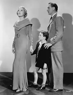 Helen Vinson wearing a draped gown by Dolly Tree