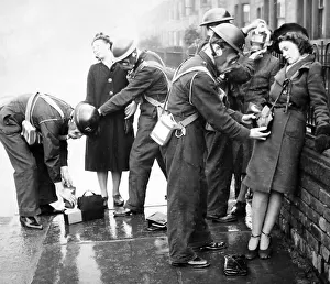 Helping to put on gas masks, ARP training exercise