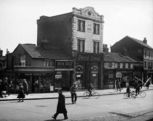 Cyclists Prints: High Street scene with David Greig grocery store