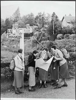 Roads Collection: Hikers by Signpost / 1935