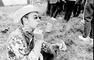Sunglasses Prints: Hippy man blowing bubbles at Woburn Park