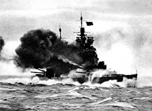 Bows Collection: HMS Duke of York firing a broadside; Second World War