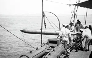 Hoisting Prints: Hoisting a recovered torpedo back on board Royal Navy