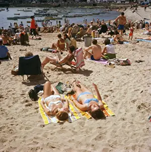 Holidaymakers on the harbour beach, St Ives, Cornwall